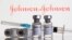 FILE - Vials labelled 'COVID-19 Coronavirus Vaccine' and syringe are seen in front of displayed Johnson & Johnson logo in this illustration taken Feb. 9, 2021.