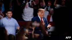 Former U.S. president and Republican presidential candidate Donald Trump arrives at a town hall meeting at the Dort Financial Center in Flint, Michigan, on Sept.17, 2024.