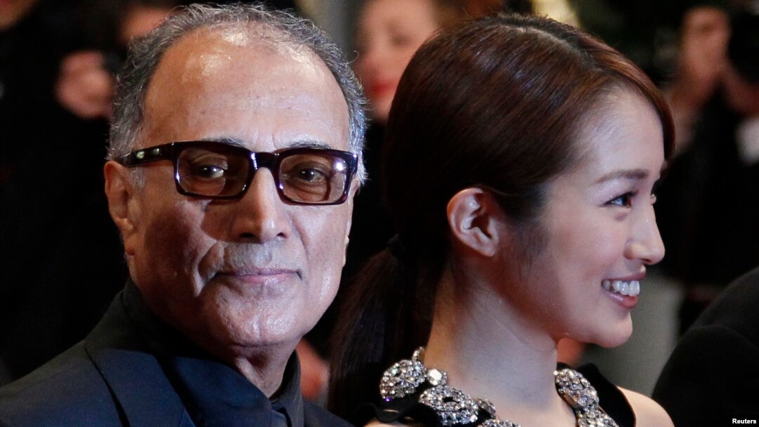FILE - Director Abbas Kiarostami (L) and cast member Rin Takanashi arrive on the red carpet for the screening of the film "Like Someone in Love", in competition at the 65th Cannes Film Festival, May 21, 2012. 