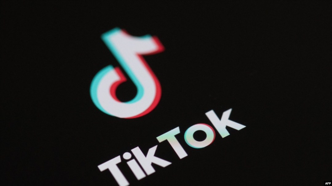 (FILES) This illustration picture taken on May 27, 2020 in Paris shows the logo of the social network application Tik Tok on the screen of a phone.