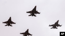 FILE— F16 fighter jet perform a maneuver as part of the African Lion military exercise, in Tantan, south of Agadir, Morocco, May 31, 2024.