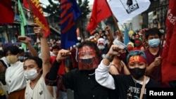 Filipino activists hold a rally in observance of Human Rights Day, in Manila, Philippines, Dec. 10, 2020.