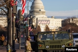 U.S. National Guardsmen patrol connected  the Pennsylvania Avenue with the Capitol Hill successful  the background, up  of the statesmanlike  inauguration of President-elect Donald Trump, successful  Washington, Jan. 18, 2025.