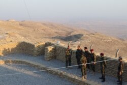 Staff Colonel Srud Salih of the Kurdish Peshmerga forces, left, says the release of prisoners who have nowhere fails to prevent a resurgence of extremist militants, near Makhmur, Iraq, Oct. 1, 2019. (H.Murdock/VOA)