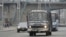 A bus covered in a net-like object drives on a street in Pyongyang, North Korea, in this photo taken by Kyodo, March 6, 2013. 