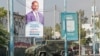 FILE - Security forces block a street with an armored personnel carrier during protests against the government and the delay of the country's election in the capital, Mogadishu, Somalia, Feb. 19, 2021.