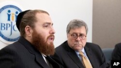 Rabbi Avi Greenstein, left, talks while Attorney General William Barr listens during a meeting of Jewish leaders at the Boro Park Jewish Community Council in New York, Jan. 28, 2020.