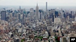FILE - Midtown Manhattan, including the Empire State Building, center, are seen from the observatory at One World Trade Center in New York, May 20, 2015.