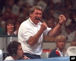 FILE - Bela Karolyi reacts with joyousness  arsenic  his gymnastics pupil  Kerri Strug finishes a regular    connected  the equilibrium  beam during the optional information   of the US Olympic Trials successful  gymnastics, June 30, 1996, successful  Boston.