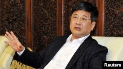 FILE - Zheng Xiaosong, the head of China's liaison office in Macau, was secretary of the Fujian Provincial Committee of the Communist Party of China, April 23, 2016.