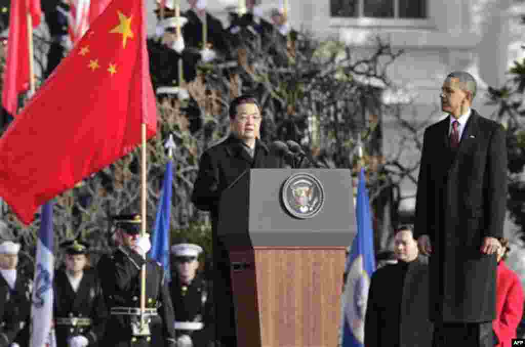 President Barack Obama watches as China's President Hu Jintao speaks during a state arrival ceremony at the White House in Washington, Wednesday, Jan. 19, 2011. (AP Photo/J. Scott Applewhite)