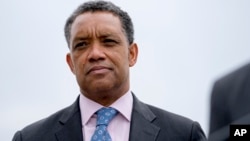 In this Feb. 26, 2018 photo, District of Columbia Attorney General Karl Racine, attends a news conference near the White House in Washington. 