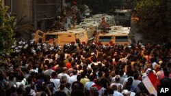 Egyptian protesters gather in front of the Israeli embassy in Cairo, Egypt, August 20, 2011.