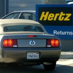 FILE - A Ford Mustang is returned to an Oakland, Calif., Hertz location, Sept. 12, 2005.