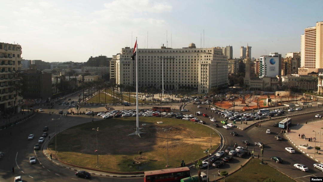 Egypt's national flag is seen raised at the top of a flag pole, which was recently installed in Tahrir square, in central Cairo, Feb. 8, 2015. 