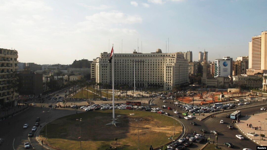Egypt's national flag is seen raised at the top of a flag pole, which was recently installed in Tahrir square, in central Cairo, Feb. 8, 2015. 
