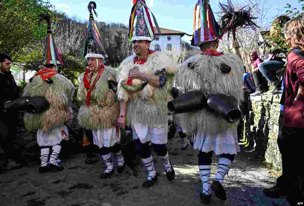 &quot;Joaldunak&quot; (bellringers in Basque language) march with big cowbells hanging on their backs during the traditional carnival of Ituren, in the northern Spanish province of Navarre, Spain.