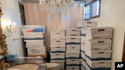 FILE - This photo, part of the indictment against former U.S. President Donald Trump, shows boxes of records stored at his Mar-a-Lago estate in Palm Beach, Florida. A federal judge on April 4, 2024, rejected Trump's argument that the documents were his personal records.