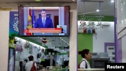 Spain's Prime Minister Pedro Sánchez is seen on a screen at the start of a live news TV broadcast announcing Spain's recognition of the Palestinian state, in a bar in Madrid, May 28, 2024. 