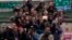 FILE - Journalists follow Tsai Ing-wen, then a presidential candidate, as she campaigns in Taipei, Jan. 13, 2016.