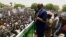 Sudanese President Omar Hassan al-Bashir addresses a crowd during a campaign rally in East Darfur, April 5, 2016. 