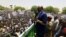 FILE - Sudanese President Omar Hassan al-Bashir addresses a crowd during a campaign rally in East Darfur, April 5, 2016. 