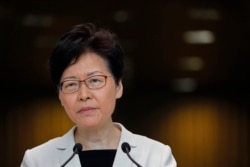 Hong Kong Chief Executive Carrie Lam listens to reporters' questions during a press conference in Hong Kong, Aug. 27, 2019.