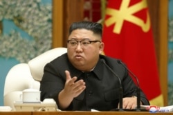 FILE - North Korean leader Kim Jong Un speaks in Pyongyang, North Korea, in this undated photo released Nov. 16, 2020, by KCNA.