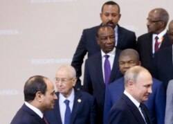 FILE - Ethiopian Prime Minister Abiy Ahmed, top center, Egyptian President Abdel-Fattah el-Sissi, bottom left, and Russian President Vladimir Putin, bottom right, are pictured at the Russia-Africa Summit in Sochi, Russia, Oct. 24, 2019.