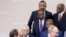 Ethiopian Prime Minister Abiy Ahmed, top center, looks as Egyptian President Abdel-Fattah el-Sissi, bottom left, and Russian President Vladimir Putin, bottom right, at the Russia-Africa summit in the Black Sea resort of Sochi, Russia, Oct. 24, 2019. 