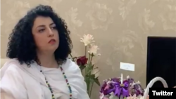 FILE - Iranian human rights activist Narges Mohammadi is seen at her parents' home in Iran, hours after being released from prison on October 8, 2020, in this screen grab from a Twitter video posted by her husband, Taghi Rahmani. 