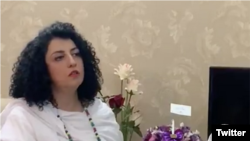 In this screen grab from a Twitter video posted by her husband, Taghi Rahmani, Iranian human rights activist Narges Mohammadi is seen at her parents' home in Iran, hours after being released from prison on October 8, 2020. (Twitter)