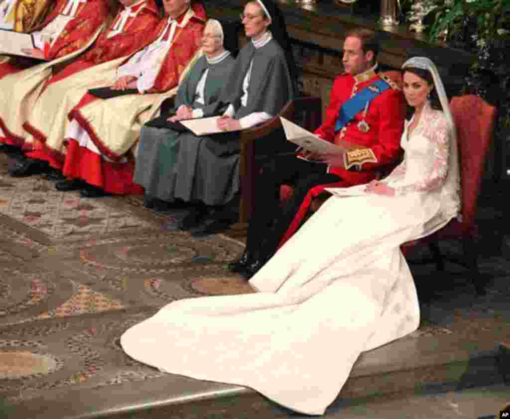 Britain's Prince William and Kate Middleton at Westminster Abbey, London, during their wedding service, April 29, 2011 (AP Photo/Anthony Devlin, Pool)
