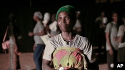 Fanta Charlotte Dabone, a mother of three who fled her village after it was attacked by extremists, participates in Recreatrales, an international theater festival held in Ouagadougou, Burkina Faso, Oct. 28, 2024. 