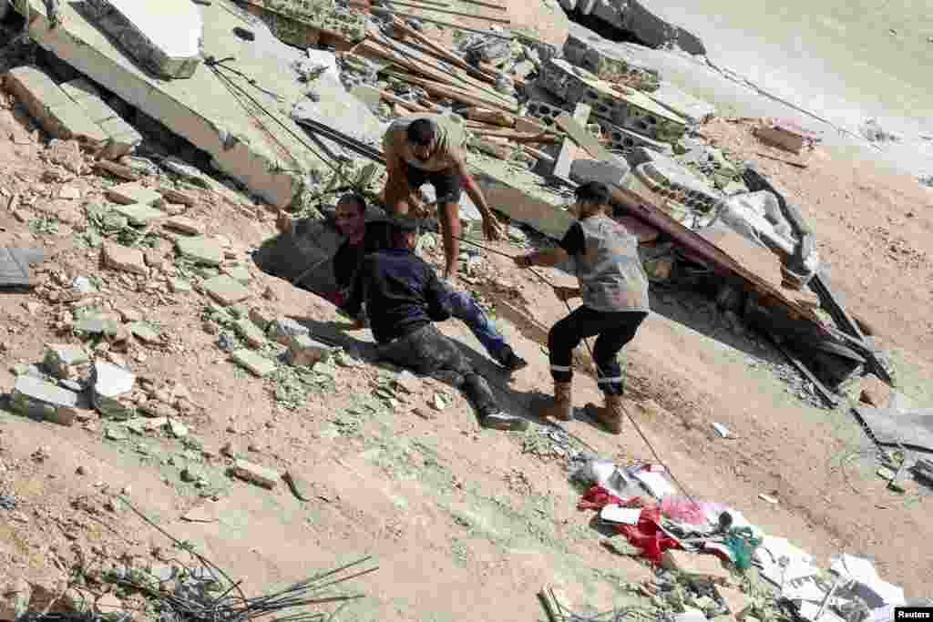 People carry out a rescue operation at the site of Sunday&#39;s Israeli attack on the city of Ain Deleb, amid the ongoing hostilities between Hezbollah and Israeli forces, in southern Lebanon.