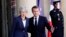 French President Emmanuel Macron, right, and British Prime Minister Theresa May pose before a meeting at the Elysee Palace in Paris, France, April 9, 2019.