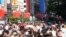Chinese national flags are seen as tourists throng the Nanjing pedestrian road, a main shopping area, on China's 69th National Day in Shanghai, China, Oct. 1, 2018.
