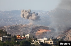 Smoke billows amid ongoing hostilities between Hezbollah and Israeli forces, as pictured from Marjayoun, near the border with Israel, Oct. 28, 2024.