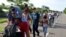 Migrants from Central America walk on a highway during their journey towards the United States, in Ciudad Hidalgo, Chiapas state, Mexico, June 5, 2019.