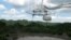 FILE - This July 13, 2016 file photo shows one of the largest single-dish radio telescopes at the Arecibo Observatory in Arecibo, Puerto Rico.