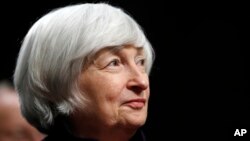 FILE - Federal Reserve Chair Janet Yellen listens to introductions as she is awarded the Paul H. Douglas Award for Ethics in Government, on Capitol Hill in Washington, Nov. 7, 2017.