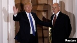 FILE - U.S. President-elect Donald Trump appears with retired Marine Corps General John Kelly outside the main clubhouse after their meeting at Trump National Golf Club in Bedminster, New Jersey, Nov. 20, 2016. 