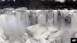 The U.S. side of Niagara Falls has begun to thaw after being partially frozen from the recent "polar vortex" that affected millions in the U.S. and Canada, Friday, Jan. 10, 2014 in Niagara Falls, N.Y.