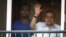 FILE - Ousted President Hosni Mubarak waves to supporters outside his hospital room where he awaits his final retrial for the deaths of hundreds of protesters during the 2011 uprising, Cairo, Oct. 6, 2015. (H.Elrasam/VOA) 