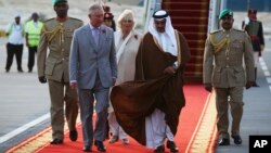 Britain's Prince Charles speaks to Bahrain's Crown Prince Salman bin Hamad bin Isa Al Khalifa upon arriving in Manama, Bahrain, Nov. 8, 2016. Prince Charles and his wife Camilla, seen behind the two princes, are on a three-nation tour of the Gulf.