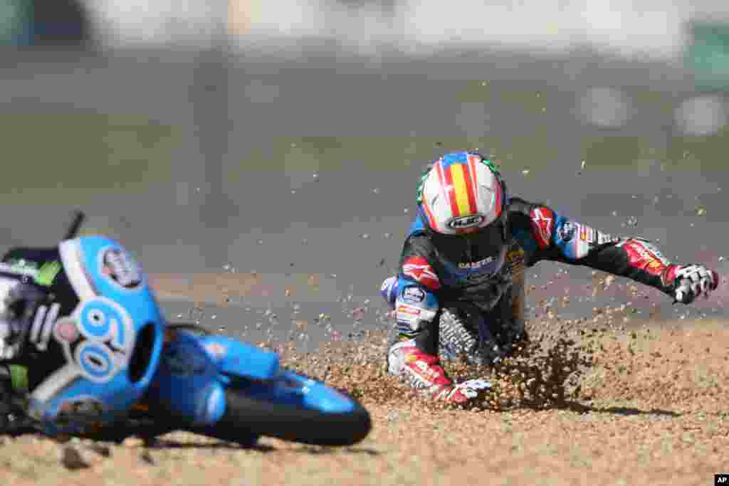 Spanish Moto 3 rider Joreg Navarro falls down during the France Motorcycle Grand Prix race at the Bugatti race track in Le Mans, western France.