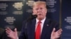 FILE - U.S. President Donald Trump gestures as he holds a news conference at the 50th World Economic Forum iin Davos, Switzerland, Jan. 22, 2020.