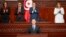 In this photo provided by the Tunisian Presidency, Tunisia's President Kais Saied is applauded after taking oath October 21, 2024 in Tunis following his reelection. 