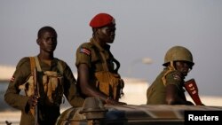 FILE - South Sudan army soldiers are seen standing in a vehicle in Juba Dec. 20, 2013.