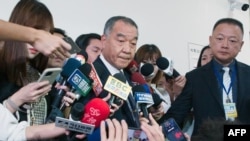 Taiwan Defense Minister Chiu Kuo-cheng speaks to reporters outside the National Defense Committee at Parliament in Taipei on Oct. 12, 2023. The initial lesson for Taiwan "is that intelligence work is very important," he said of the Israel-Hamas conflict.